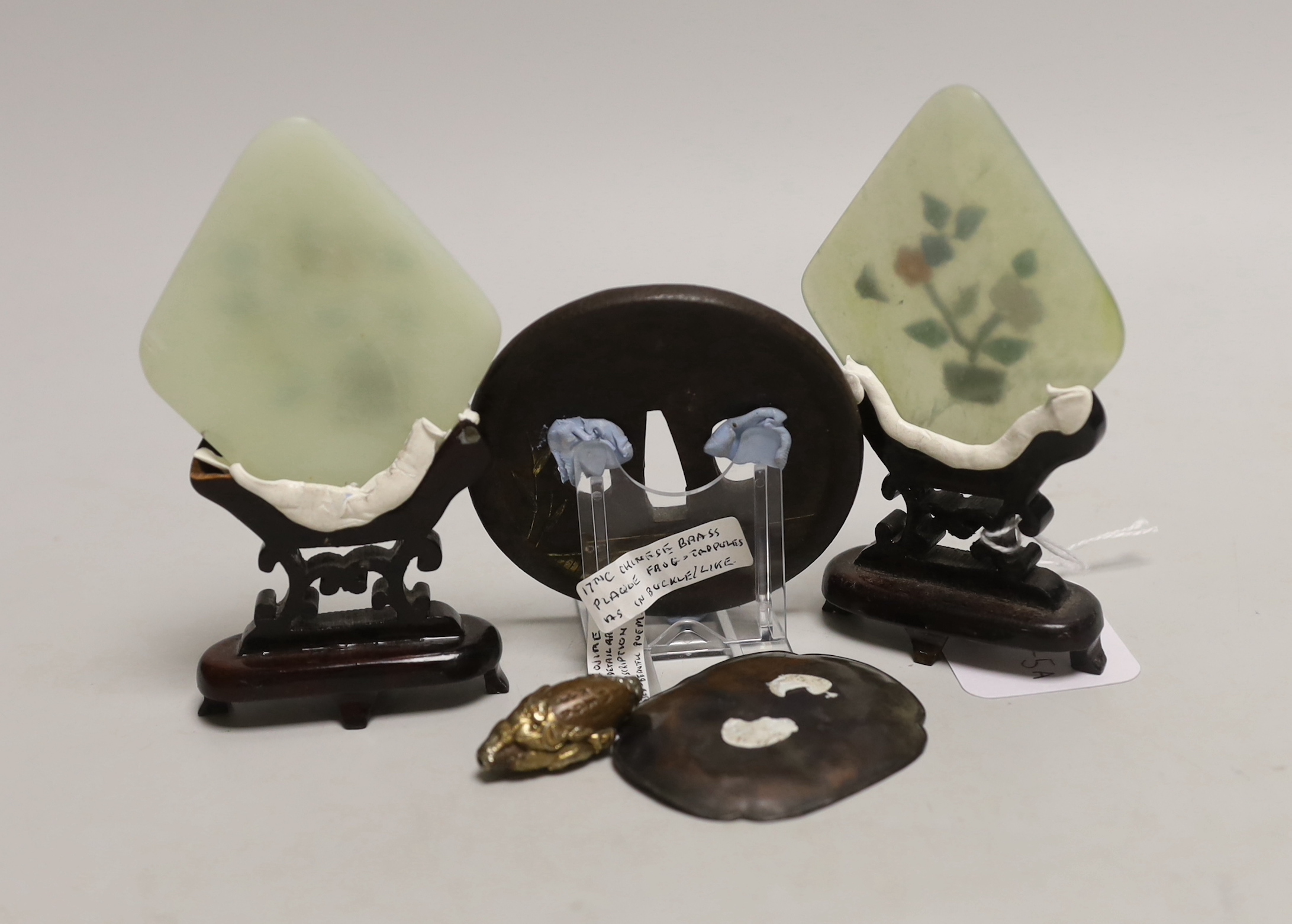 A pair of Chinese bowenite miniature table screens on hardwood stands, 12cm, a gilt cast iron Japanese tsuba, gilt bronze ojime and pin dish